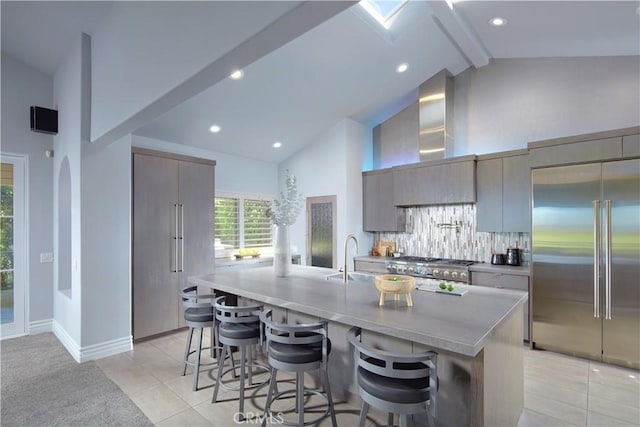 4347 Canyon View Ln, Palos Verdes Peninsula, CA 90274 - kitchen featuring appliances with stainless steel finishes, high vaulted ceiling, modern cabinets, a breakfast bar area, and light tile patterned floors