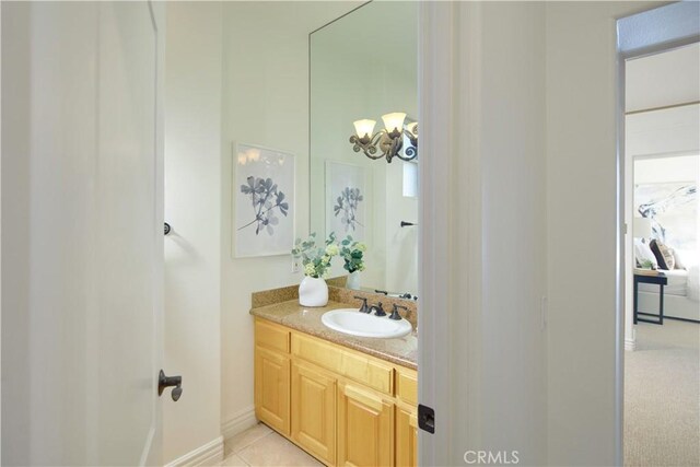 4347 Canyon View Ln, Palos Verdes Peninsula, CA 90274 - bathroom with vanity, a chandelier, and tile patterned floors