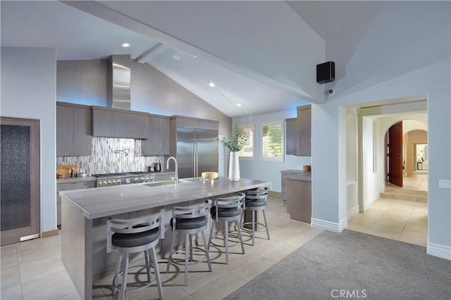 4347 Canyon View Ln, Palos Verdes Peninsula, CA 90274 - kitchen featuring stainless steel built in refrigerator, arched walkways, modern cabinets, a breakfast bar, and light tile patterned floors
