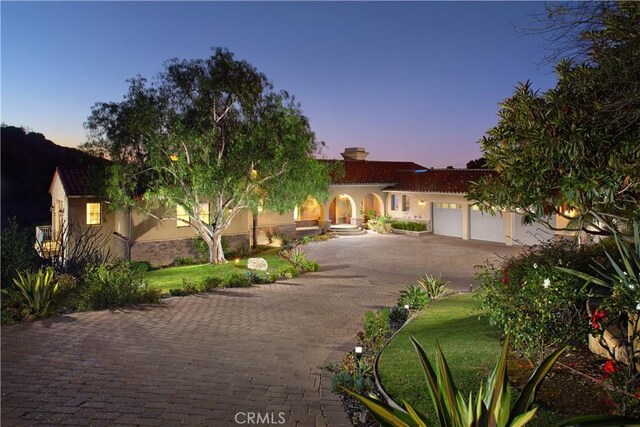 4347 Canyon View Ln, Palos Verdes Peninsula, CA 90274 - mediterranean / spanish house featuring stucco siding, driveway, a garage, and a chimney