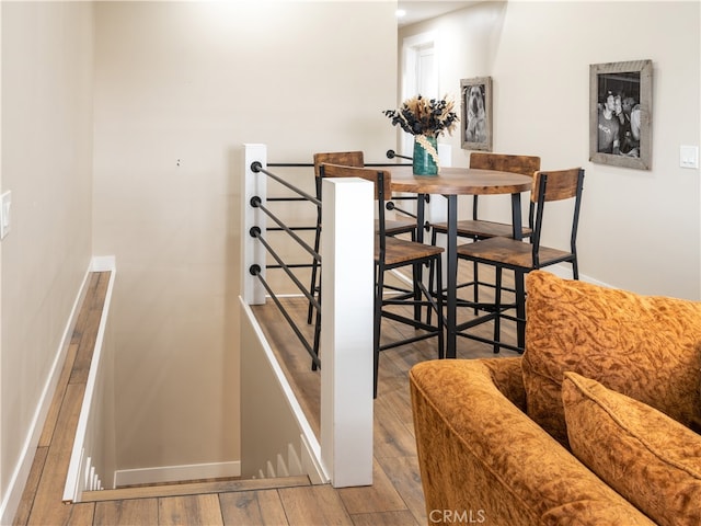 dining area with light hardwood / wood-style floors