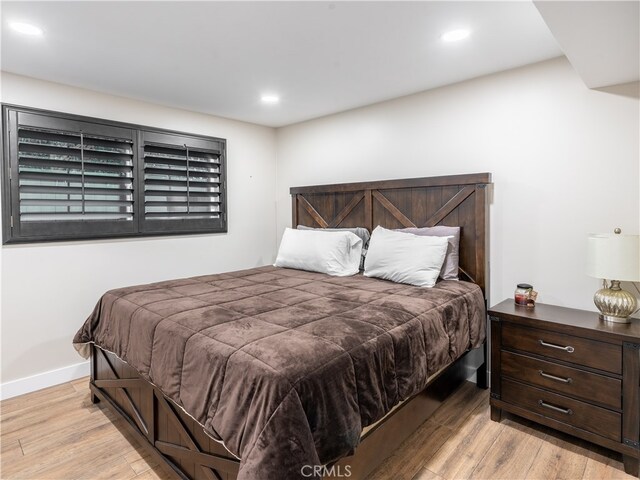 bedroom featuring light hardwood / wood-style floors