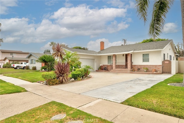 ranch-style home with a front lawn and a garage