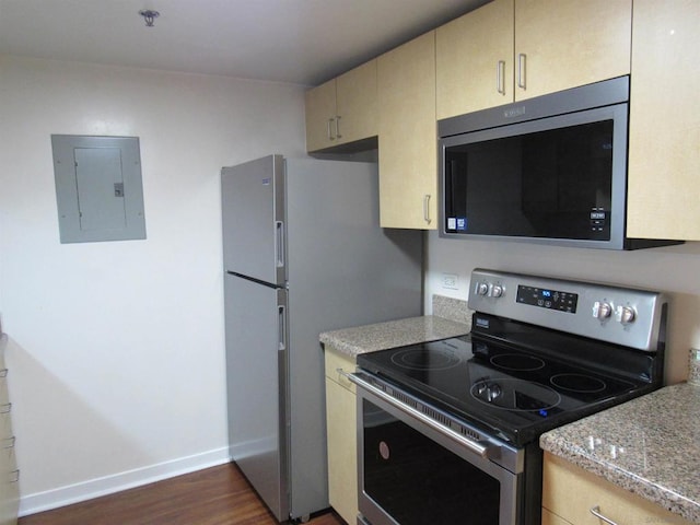 kitchen with light brown cabinets, electric panel, dark wood-type flooring, and stainless steel appliances