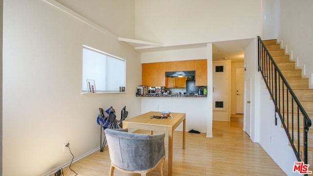 dining area featuring light wood-type flooring