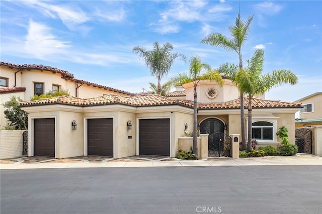 mediterranean / spanish home featuring a garage