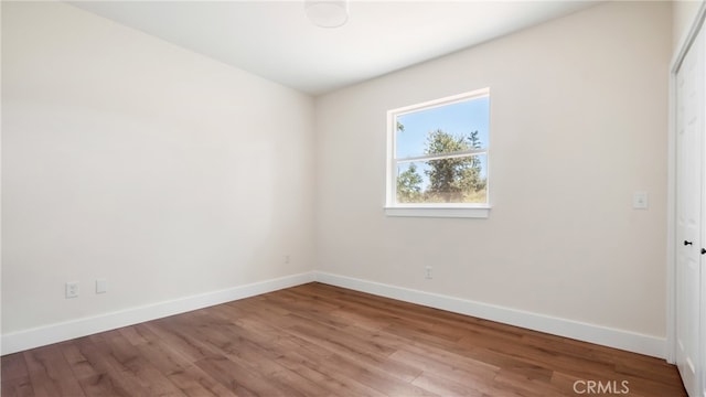 empty room featuring wood-type flooring