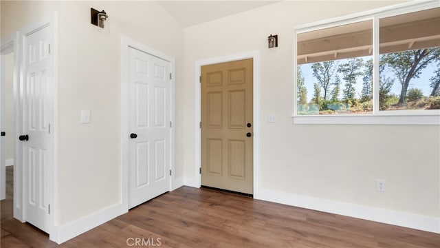 entrance foyer with dark hardwood / wood-style flooring