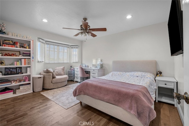 bedroom with dark wood-type flooring and ceiling fan