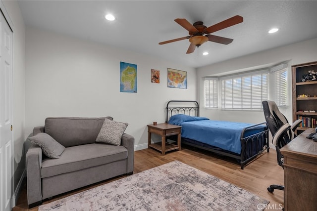 bedroom featuring a closet, ceiling fan, and wood-type flooring