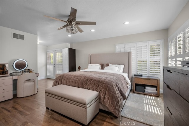 bedroom with ceiling fan and hardwood / wood-style flooring