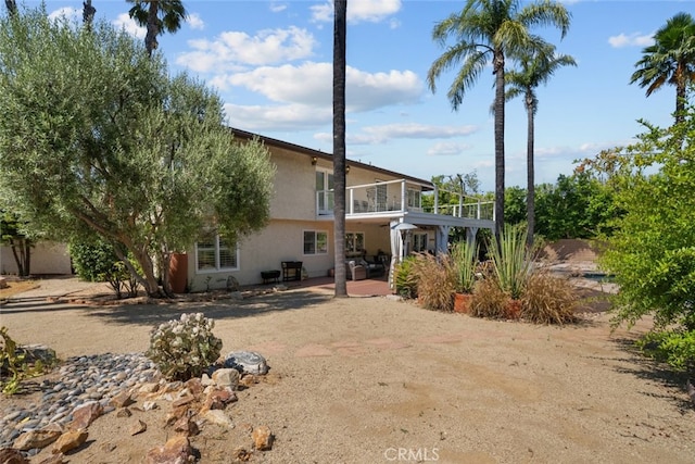 back of property featuring a patio