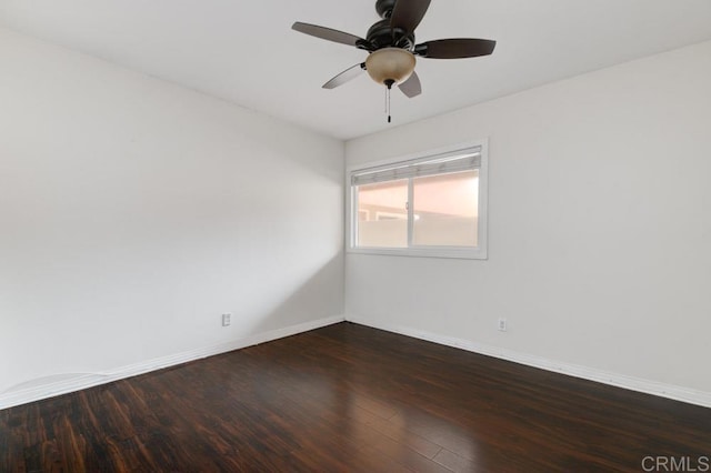 unfurnished room featuring ceiling fan and dark hardwood / wood-style flooring