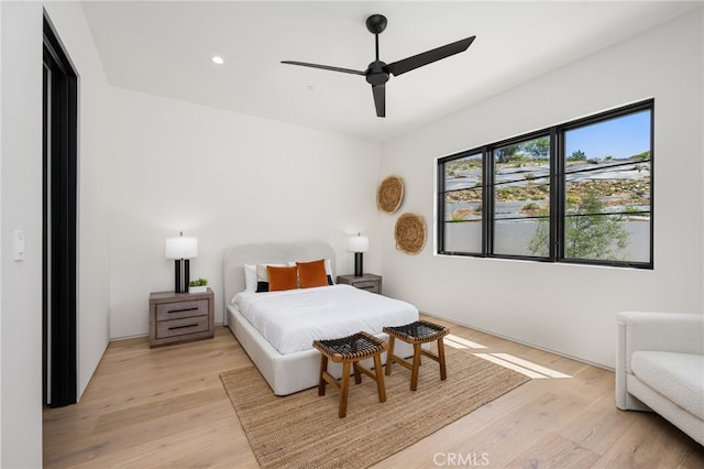 bedroom featuring ceiling fan and light wood-type flooring