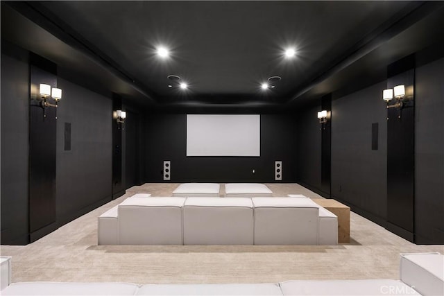 home theater room with a raised ceiling