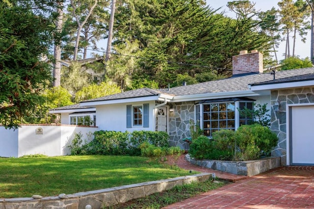 ranch-style house with a front yard