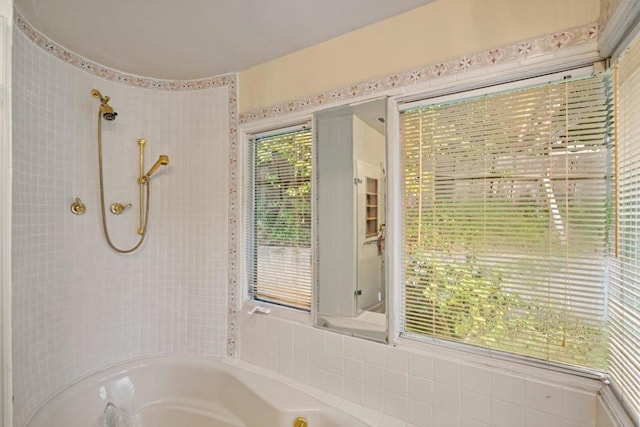 bathroom featuring separate shower and tub