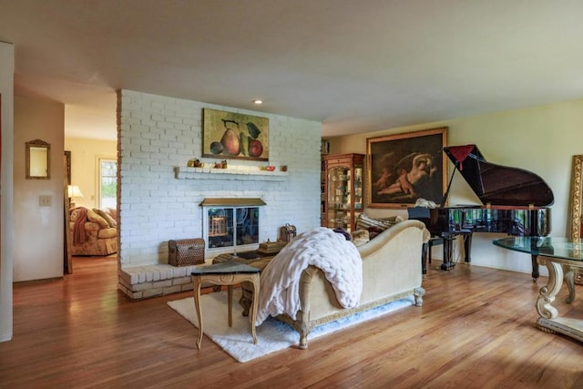 living room featuring a fireplace and hardwood / wood-style floors