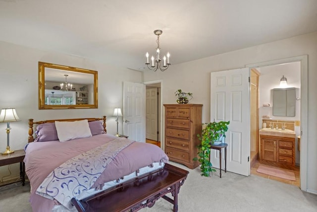 bedroom featuring carpet, connected bathroom, a chandelier, and sink