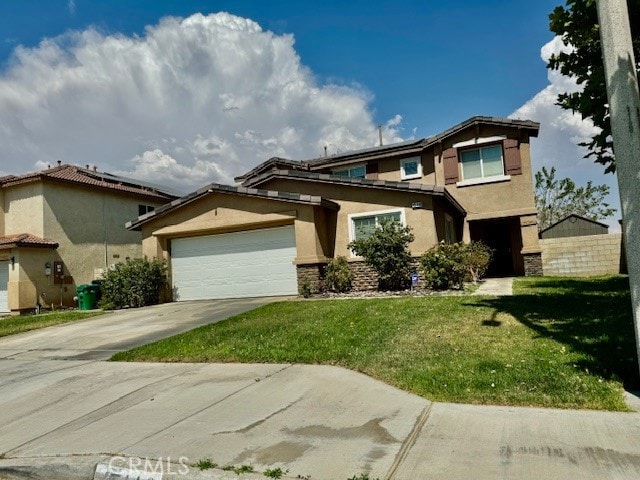 view of front of home featuring a front lawn and a garage