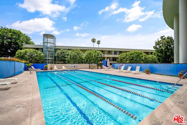 view of pool featuring a patio