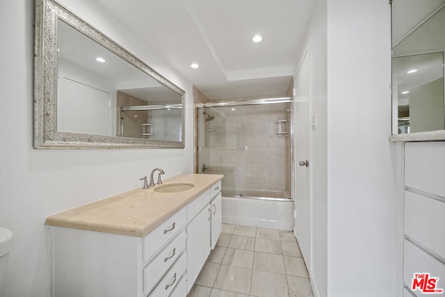 full bathroom with shower / bath combination with glass door, vanity, toilet, and tile patterned floors