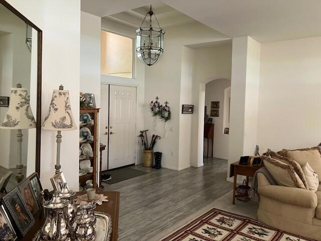 interior space with hardwood / wood-style floors and a notable chandelier