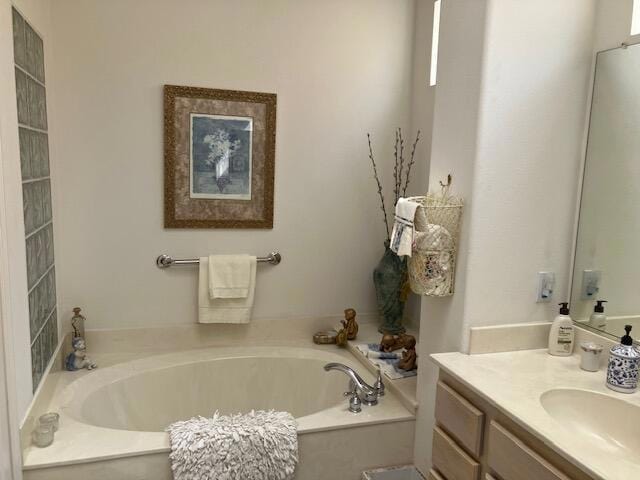 bathroom with a bathtub and vanity