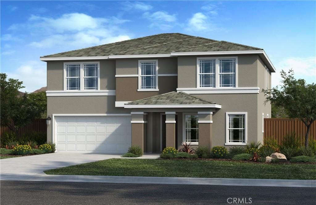 view of front facade with a front yard and a garage