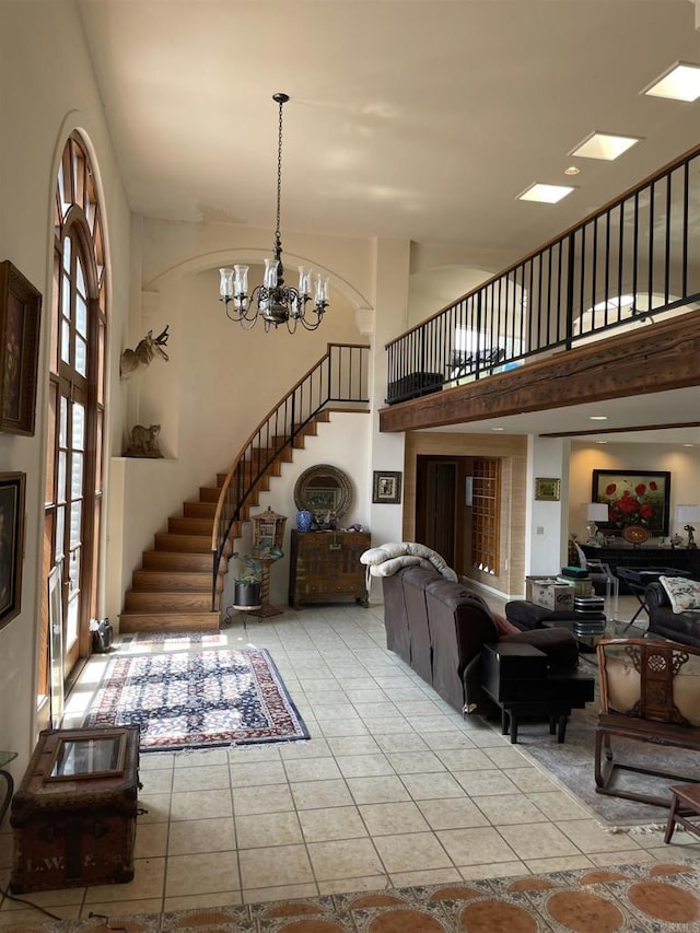 living room featuring light tile patterned flooring and an inviting chandelier