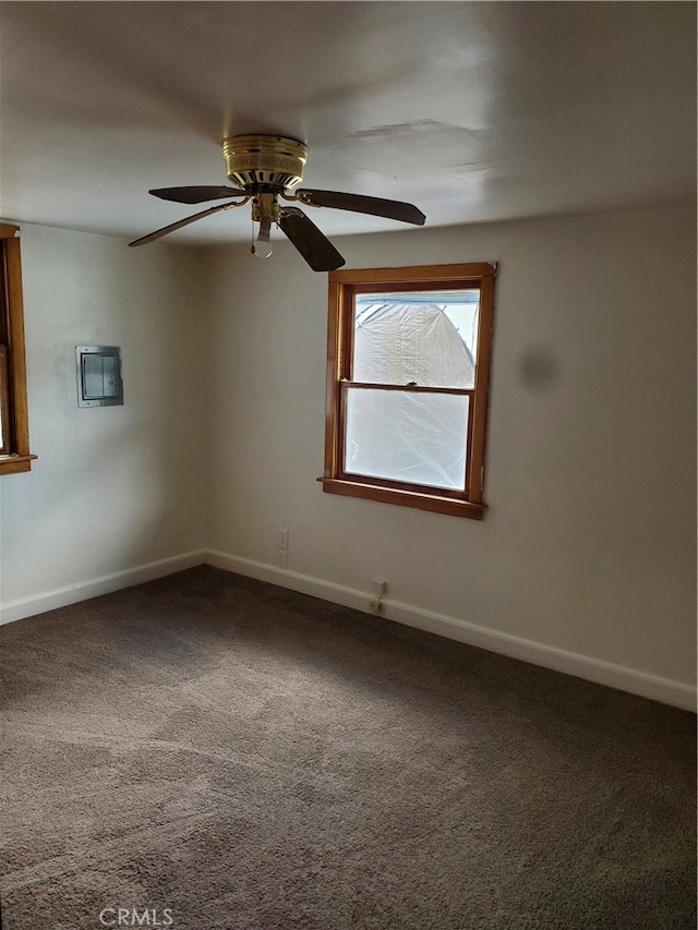 carpeted empty room featuring ceiling fan