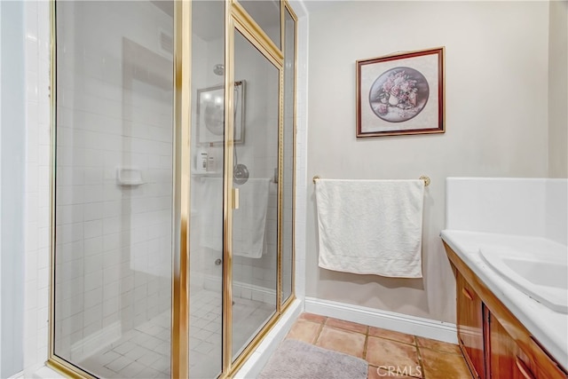 bathroom with vanity, tile patterned flooring, and an enclosed shower