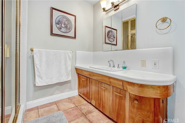 bathroom with tile patterned flooring and vanity