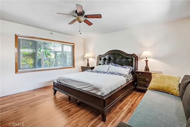 bedroom featuring light wood-type flooring and ceiling fan