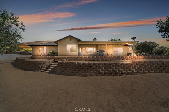 ranch-style house with a patio area