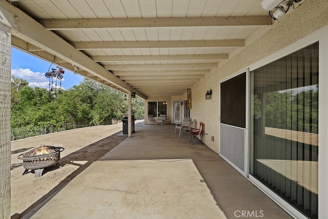 view of patio / terrace featuring a fire pit