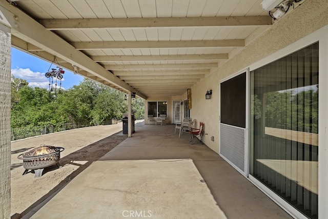 view of patio featuring a fire pit