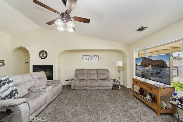 living room featuring ceiling fan, carpet flooring, and lofted ceiling