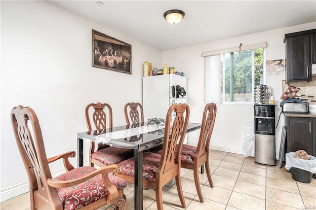 dining area featuring light tile patterned floors