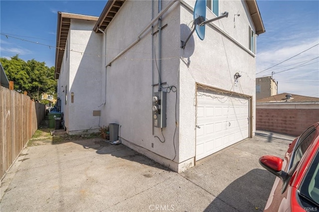 view of property exterior featuring a garage