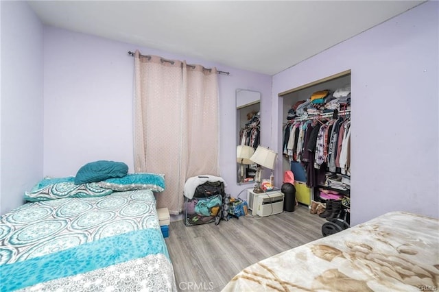 bedroom with a closet and wood-type flooring