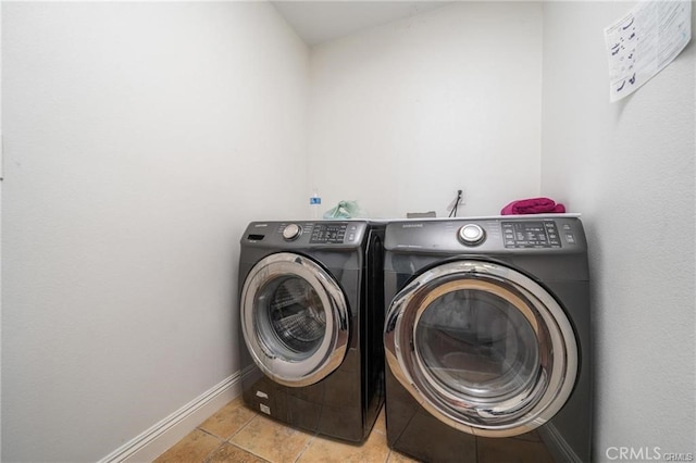 washroom featuring washer and clothes dryer