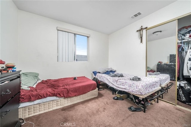 bedroom featuring a closet and carpet