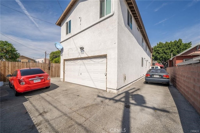 view of side of property featuring a garage