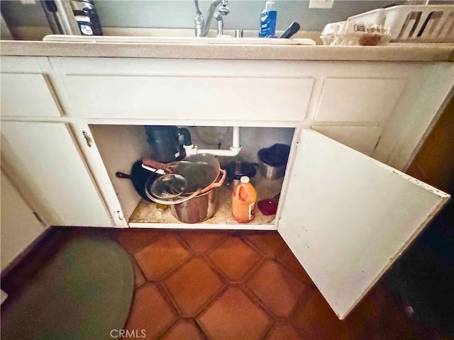 interior details featuring white cabinetry