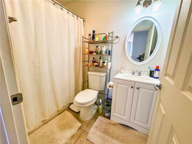 bathroom featuring vanity, curtained shower, toilet, and tile patterned flooring