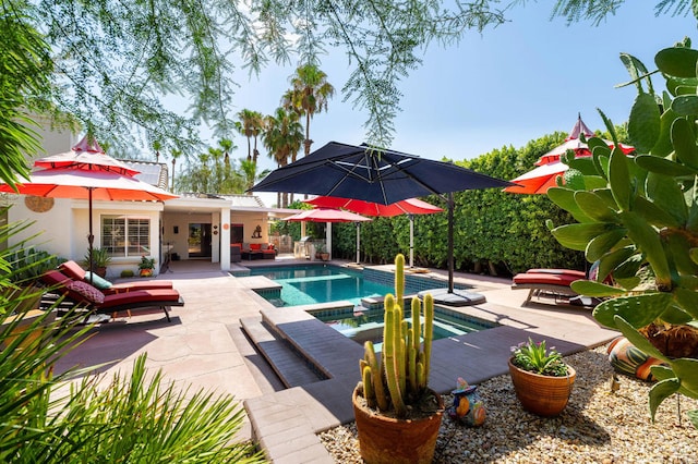 view of swimming pool featuring a patio area