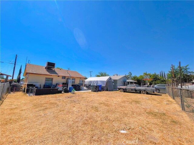 view of yard featuring central air condition unit