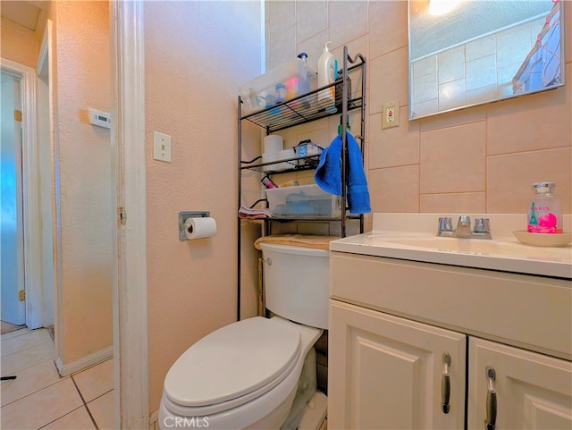 bathroom with tile patterned floors, vanity, and toilet