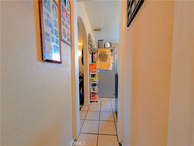 hallway featuring light tile patterned floors